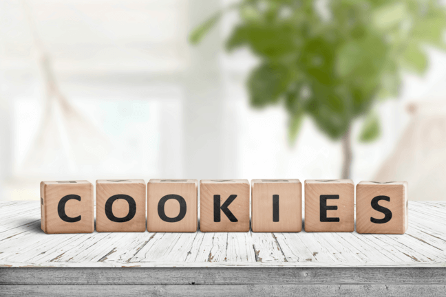 wooden blocks on the table with cookies writing on them