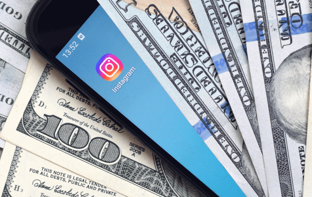 a phone between cash money that is worthy because of instagram.