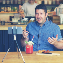 A man working on a video record about food and bevereages to get more Instagram followers.