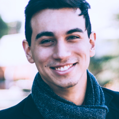 It is the portratit of a young happy smiling man.